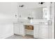 Bright bathroom with double vanity, stylish mirrors, modern lighting fixtures and white cabinets at 1241 Keith Rd, Wake Forest, NC 27587