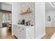 Butler's pantry features a beverage station and floating shelves, perfect for entertaining guests at 1241 Keith Rd, Wake Forest, NC 27587