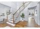 Grand foyer features hardwood floors, stairs with wood railing, white trim and shiplap walls at 1241 Keith Rd, Wake Forest, NC 27587