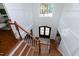 Foyer with hardwood stairs and view of the front door at 1241 Keith Rd, Wake Forest, NC 27587
