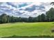 Expansive view of the lush green golf course, perfect for outdoor enjoyment and recreation at 1241 Keith Rd, Wake Forest, NC 27587