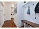 Hallway leading to the mud room with hardwood floors and white walls at 1241 Keith Rd, Wake Forest, NC 27587