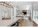 Modern kitchen featuring a large island, stainless steel appliances, and an open layout to the living area at 1241 Keith Rd, Wake Forest, NC 27587