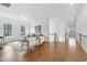 Bright living room with hardwood floors, neutral decor, and staircase to upper level at 1241 Keith Rd, Wake Forest, NC 27587