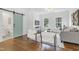 Living room with hardwood floors, a sliding barn door and a comfortable seating area at 1241 Keith Rd, Wake Forest, NC 27587