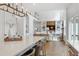 Open floor plan showcases a kitchen island connected to a living room with built-in shelving and a fireplace at 1241 Keith Rd, Wake Forest, NC 27587