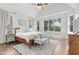 Spacious main bedroom filled with natural light from multiple windows, featuring hardwood floors at 1241 Keith Rd, Wake Forest, NC 27587