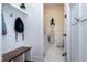 Mud room boasts a wooden bench with hooks, with laundry room visible in the background at 1241 Keith Rd, Wake Forest, NC 27587