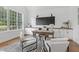 Bright home office featuring a large window, built in cabinets, and modern decor at 1241 Keith Rd, Wake Forest, NC 27587