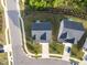 Stunning aerial view showcases a well-maintained home with a pristine roof and landscaped yard in a peaceful neighborhood at 128 Highland Grove Way, Fuquay Varina, NC 27526