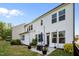 Outdoor space featuring a patio with seating, lush lawn, and well-kept landscaping at 128 Highland Grove Way, Fuquay Varina, NC 27526