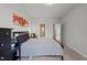 Comfortable bedroom with a large bed, side tables, dresser, and en-suite bathroom at 128 Highland Grove Way, Fuquay Varina, NC 27526