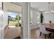A modern dining room with a table, chairs, and view of the porch at 128 Highland Grove Way, Fuquay Varina, NC 27526