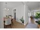 Bright dining room with wood floors and stylish decor, flowing into the living area for easy living at 128 Highland Grove Way, Fuquay Varina, NC 27526