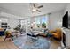Inviting living room with ample natural light, a fireplace, and tasteful decor for a cozy atmosphere at 128 Highland Grove Way, Fuquay Varina, NC 27526