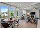 Sun-drenched living area flows seamlessly to an outdoor dining space, offering versatile entertaining options at 128 Highland Grove Way, Fuquay Varina, NC 27526