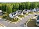 Charming neighborhood street view features well-manicured lawns and craftsman-style homes backing to a lush greenbelt at 128 Highland Grove Way, Fuquay Varina, NC 27526