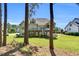 Back exterior showcasing deck, covered patio, stairs, screened porch and green lawn at 128 Paraggi Ct, Clayton, NC 27527
