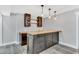Home bar with wooden countertop, dark cabinets, and pendant lighting at 128 Paraggi Ct, Clayton, NC 27527
