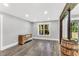 Finished basement featuring a large window, stylish dresser and rustic wooden beam at 128 Paraggi Ct, Clayton, NC 27527
