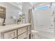 Clean bathroom with marble vanity, subway tile shower, and a bright window at 128 Paraggi Ct, Clayton, NC 27527