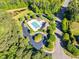 Aerial view of a community pool with parking and mature landscaping at 128 Paraggi Ct, Clayton, NC 27527