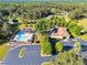 Aerial view of neighborhood amenities including clubhouse, pool and parking at 128 Paraggi Ct, Clayton, NC 27527