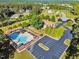 Community pool, clubhouse, and parking area viewed from above at 128 Paraggi Ct, Clayton, NC 27527