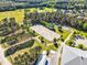 Overhead view of an expansive equestrian center with riding arenas and stables at 128 Paraggi Ct, Clayton, NC 27527