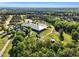 Aerial shot of an equestrian center with barns, riding arenas, and surrounding fields at 128 Paraggi Ct, Clayton, NC 27527