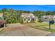 Beautiful two-story home featuring lush landscaping and concrete driveway at 128 Paraggi Ct, Clayton, NC 27527