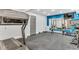 Home gym with fitness equipment, mirrors, and blue accent wall at 128 Paraggi Ct, Clayton, NC 27527