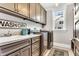 Functional laundry room with ample cabinet space, sink, and modern washer/dryer units at 128 Paraggi Ct, Clayton, NC 27527