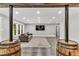 Finished basement living room with rustic columns, neutral tones, and ample seating at 128 Paraggi Ct, Clayton, NC 27527