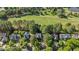 Aerial view showcasing roof, landscape, and surrounding neighborhood, adjacent to golf course at 1401 Marshall Farm St, Wake Forest, NC 27587