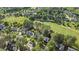 Elevated view highlights the roof, landscaping, neighborhood, and golf course, creating an inviting setting at 1401 Marshall Farm St, Wake Forest, NC 27587