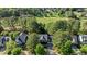 An aerial showcases the home's roof and landscape, adjacent to a green golf course and other residences at 1401 Marshall Farm St, Wake Forest, NC 27587