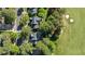 Overhead view of the property's roof, landscaping, and proximity to a lush, green golf course at 1401 Marshall Farm St, Wake Forest, NC 27587