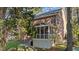 Brick home with a screened porch overlooking a nicely landscaped backyard and green lawn at 1401 Marshall Farm St, Wake Forest, NC 27587