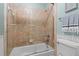Clean and functional bathroom with a tiled shower-tub, towel rack, and modern fixtures at 1401 Marshall Farm St, Wake Forest, NC 27587