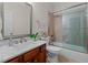 Well-lit bathroom featuring a marble countertop vanity and a shower-over-tub combo at 1401 Marshall Farm St, Wake Forest, NC 27587