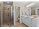 Bright bathroom with walk-in shower and white vanity at 1401 Marshall Farm St, Wake Forest, NC 27587