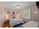 Comfortable bedroom featuring hardwood floors, natural light, and stylish decor at 1401 Marshall Farm St, Wake Forest, NC 27587