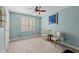 Bedroom featuring a ceiling fan, neutral walls, and a window with plantation shutters at 1401 Marshall Farm St, Wake Forest, NC 27587