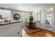 Charming dining area featuring natural light, hardwood floors, and modern decor at 1401 Marshall Farm St, Wake Forest, NC 27587
