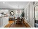 Well-lit dining area with a modern chandelier and seating for six guests at 1401 Marshall Farm St, Wake Forest, NC 27587