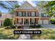 Charming two-story brick home with a welcoming front porch and well-manicured landscaping at 1401 Marshall Farm St, Wake Forest, NC 27587