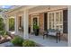 Inviting covered porch with brick flooring and benches, perfect for relaxing outdoors at 1401 Marshall Farm St, Wake Forest, NC 27587