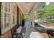 Long covered front porch with benches and classic white columns offers a welcoming space at 1401 Marshall Farm St, Wake Forest, NC 27587