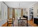 Stylish home office with hardwood floors, plantation shutters, and contemporary lighting at 1401 Marshall Farm St, Wake Forest, NC 27587